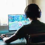 teenager-playing-fortnite-video-game-on-pc